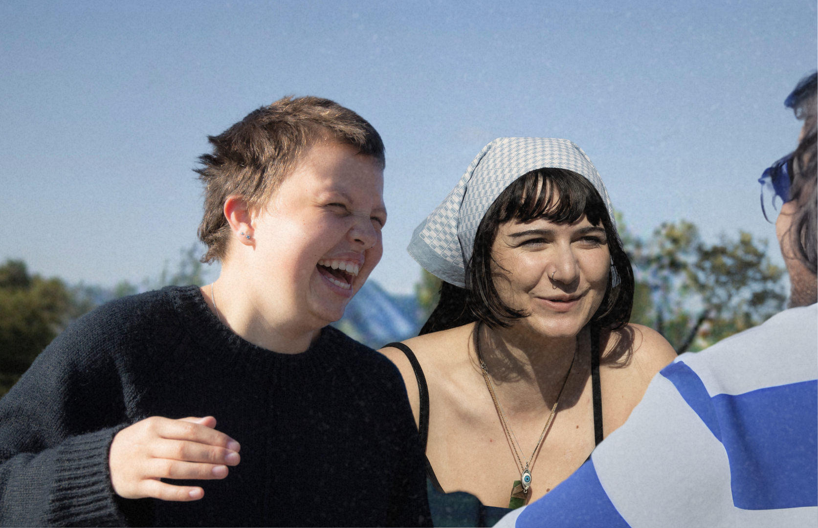 two young people wearing cancer charity canteen bandannas