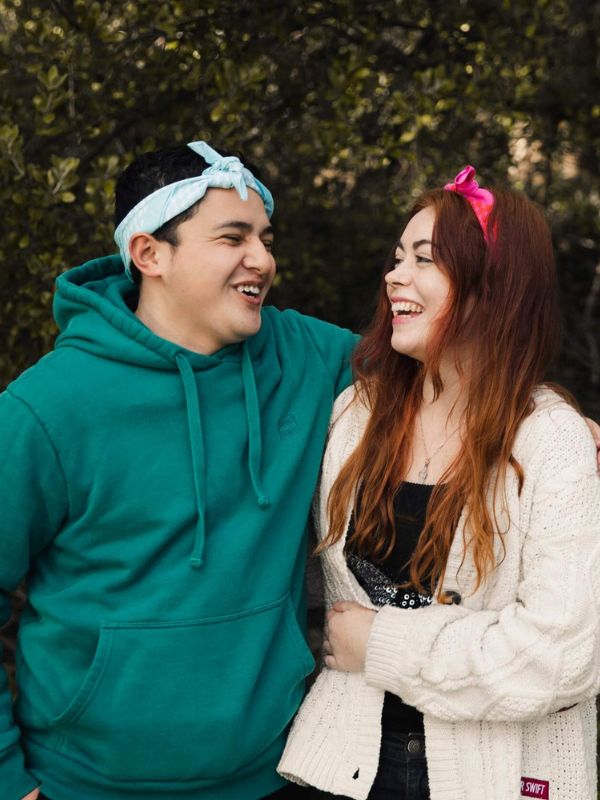 two young people wearing cancer charity bandannas from canteen