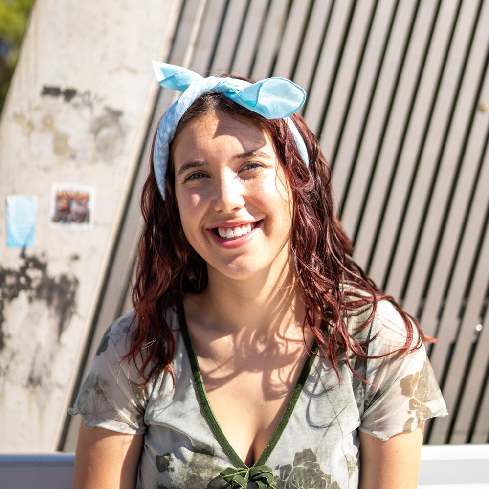 two young people wearing cancer charity canteen bandannas and hugging