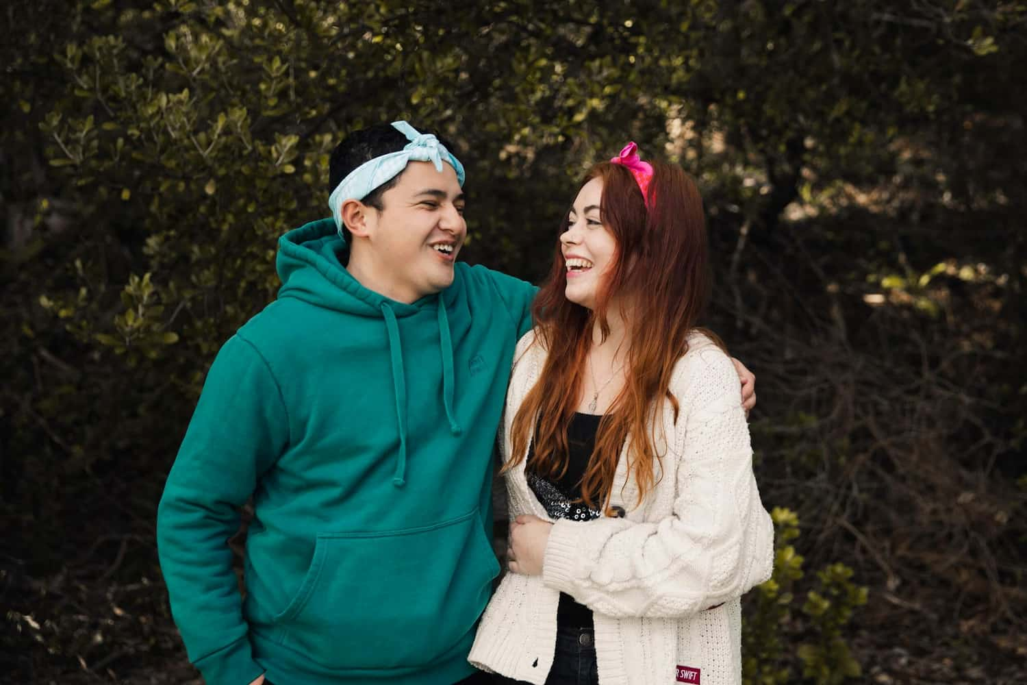 two young people wearing cancer charity canteen bandannas