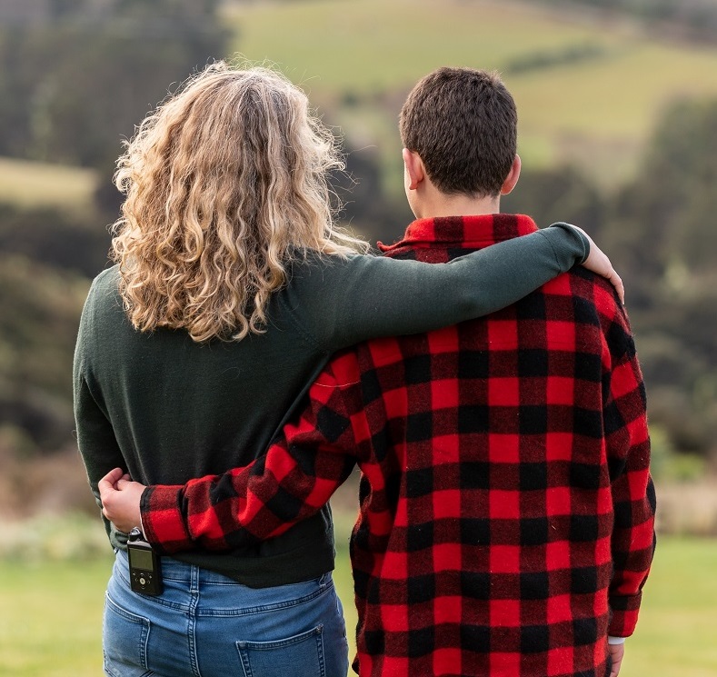 young person and their parent hugging