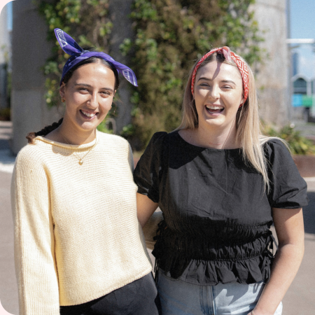 two young people wearing cancer charity canteen bandannas