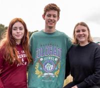 three young people at a canteen leadership camp